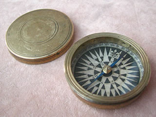 Antique brass cased pocket compass with domed lid